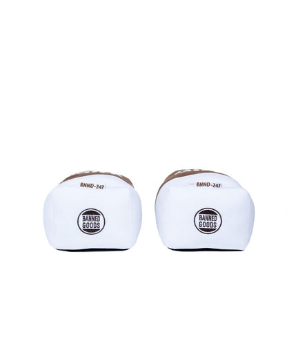 A pair of plush slippers with brown trim and a circular black and white 'BAND-FOODS' logo on the front, set against a plain white background.