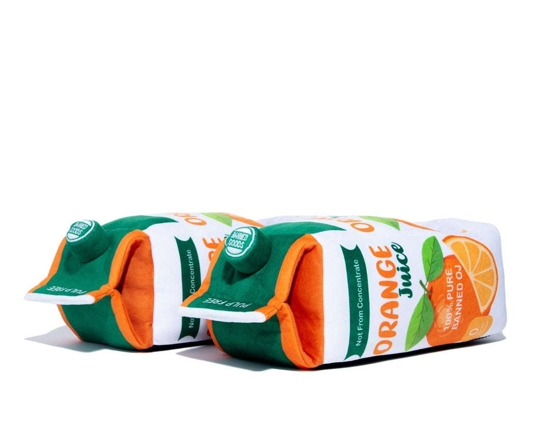  orange juice themed plush slipper arranged in a row on a plain white background.