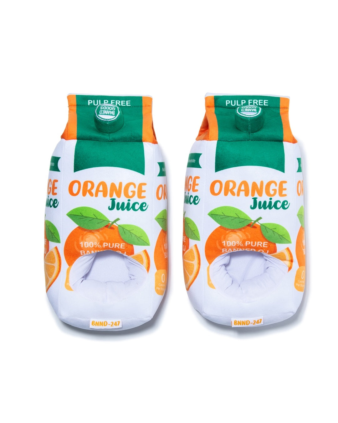 Two novelty plush slippers designed to look like orange juice cartons, featuring green and orange graphics with illustrations of oranges and leaves on a white background.