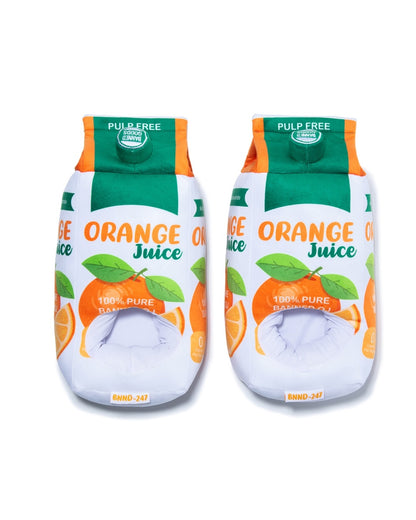 Two novelty plush slippers designed to look like orange juice cartons, featuring green and orange graphics with illustrations of oranges and leaves on a white background.